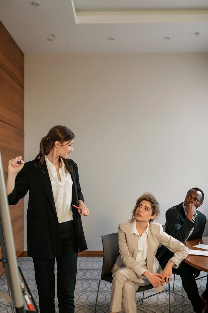 services-04 Group of diverse professionals engaging in a collaborative office meeting indoors.